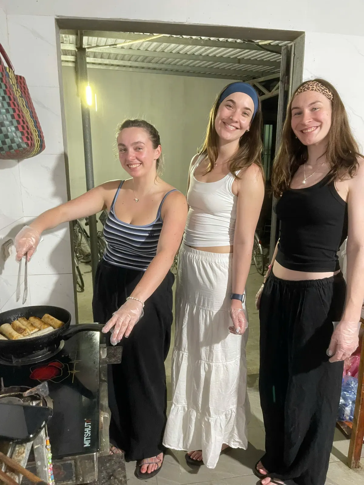 Guests cooking together in the homestay kitchen